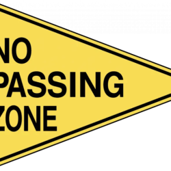 A no passing sign is blank shaped