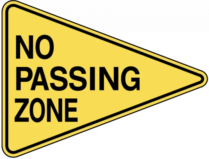 A no passing sign is blank shaped