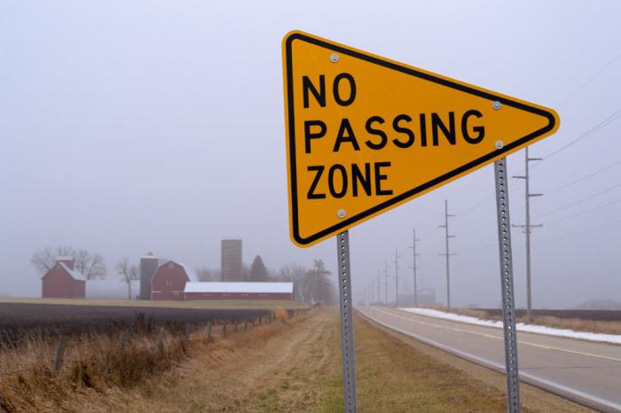 A no passing sign is blank shaped